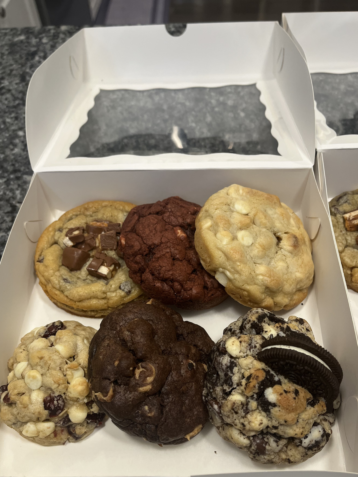 Six assorted jumbo cookies in a display box