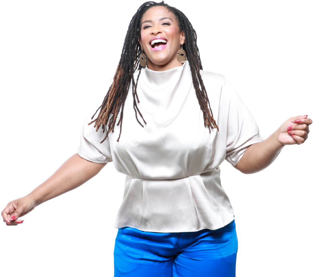 Woman with long dreadlocks, wearing earrings, a satin creme blouse, and royal blue pants, smiling and dancing.