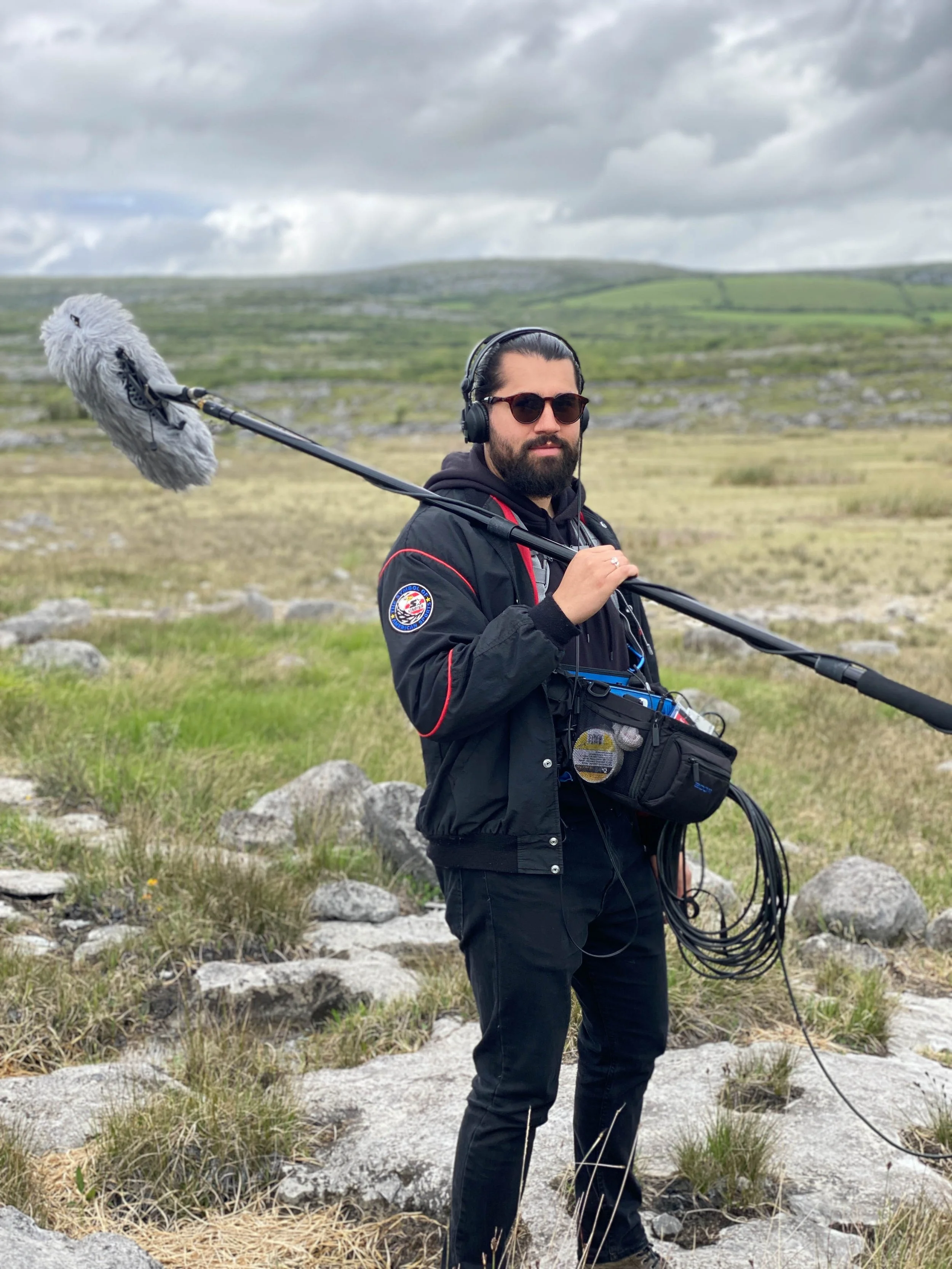 Jordan Murshed working as production-sound mixer during an outdoor television production in the Burren