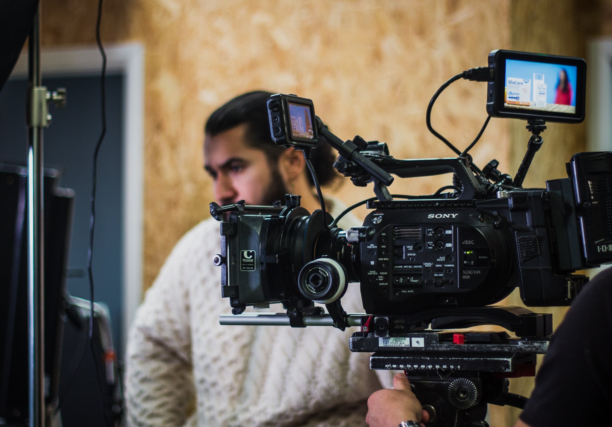 Jordan Murshed directing a commercial video production during filming.