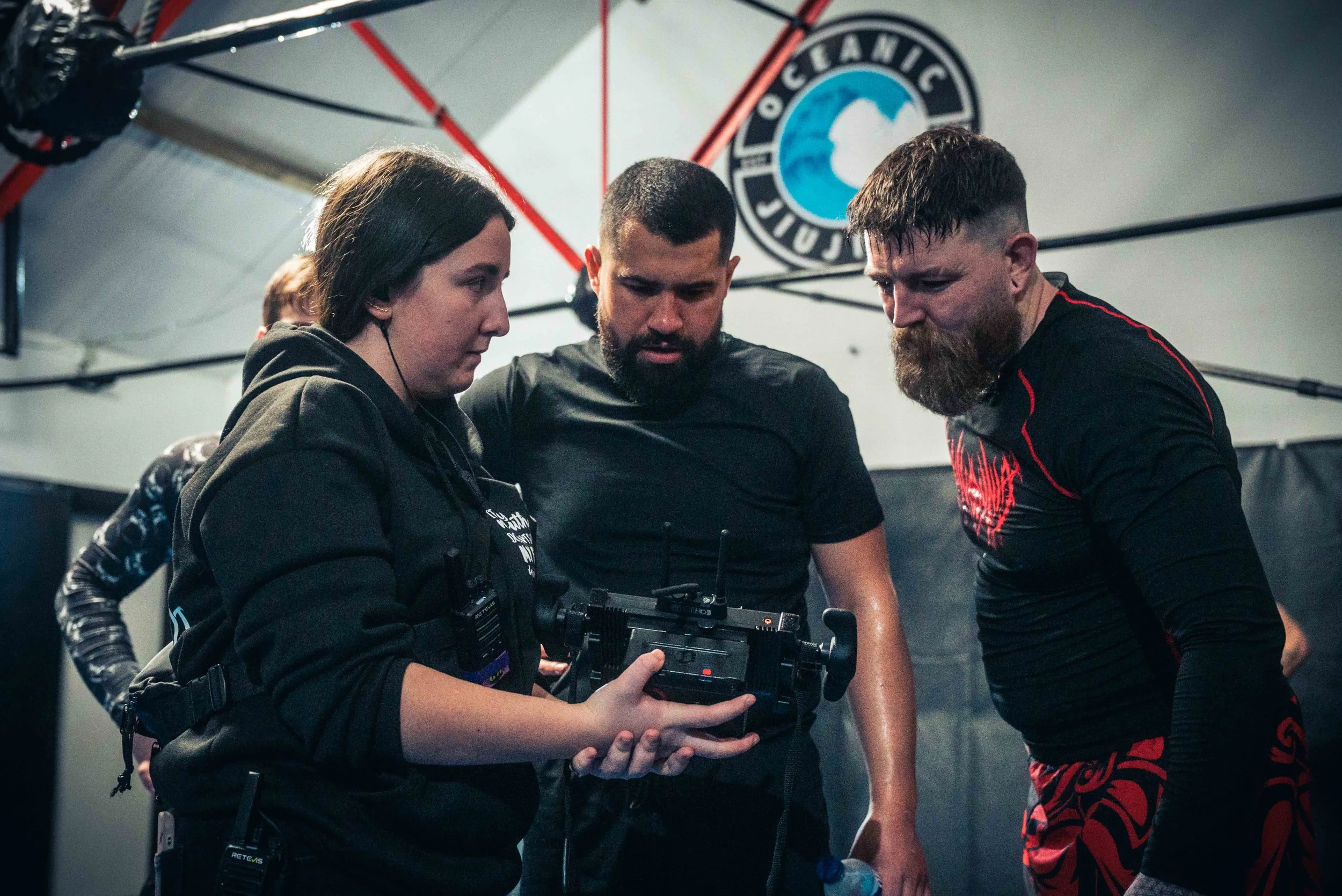 Jordan Murshed directing and reviewing footage with cast and crew during production of the short film The Comeback.