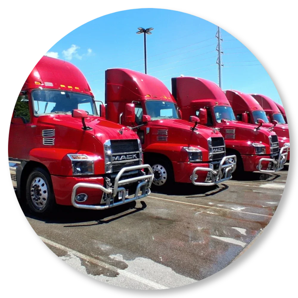 Clean commercial fleet trucks lined up after professional fleet washing service in the Roanoke Valley