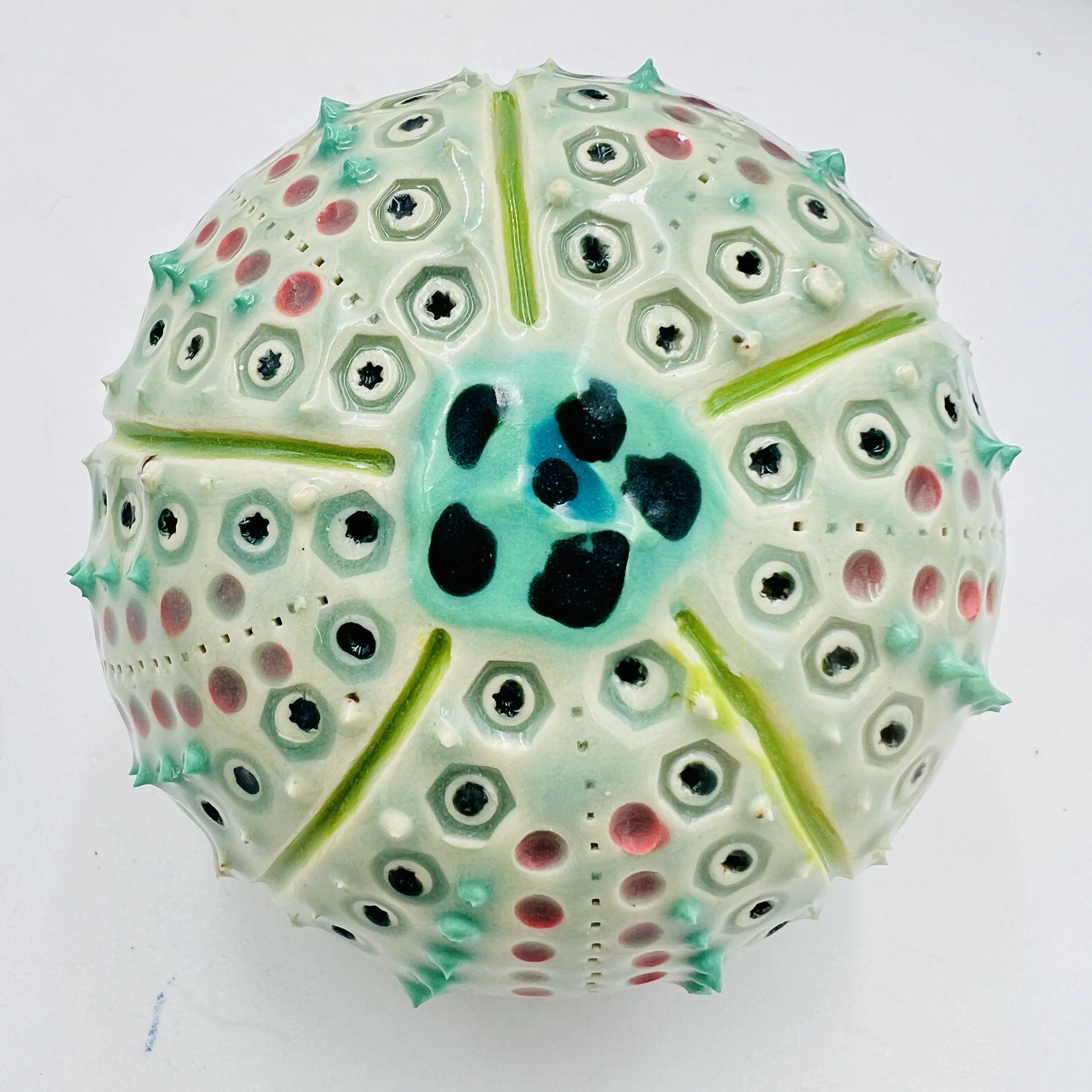 An intricately decorated ceramic sea urchin
