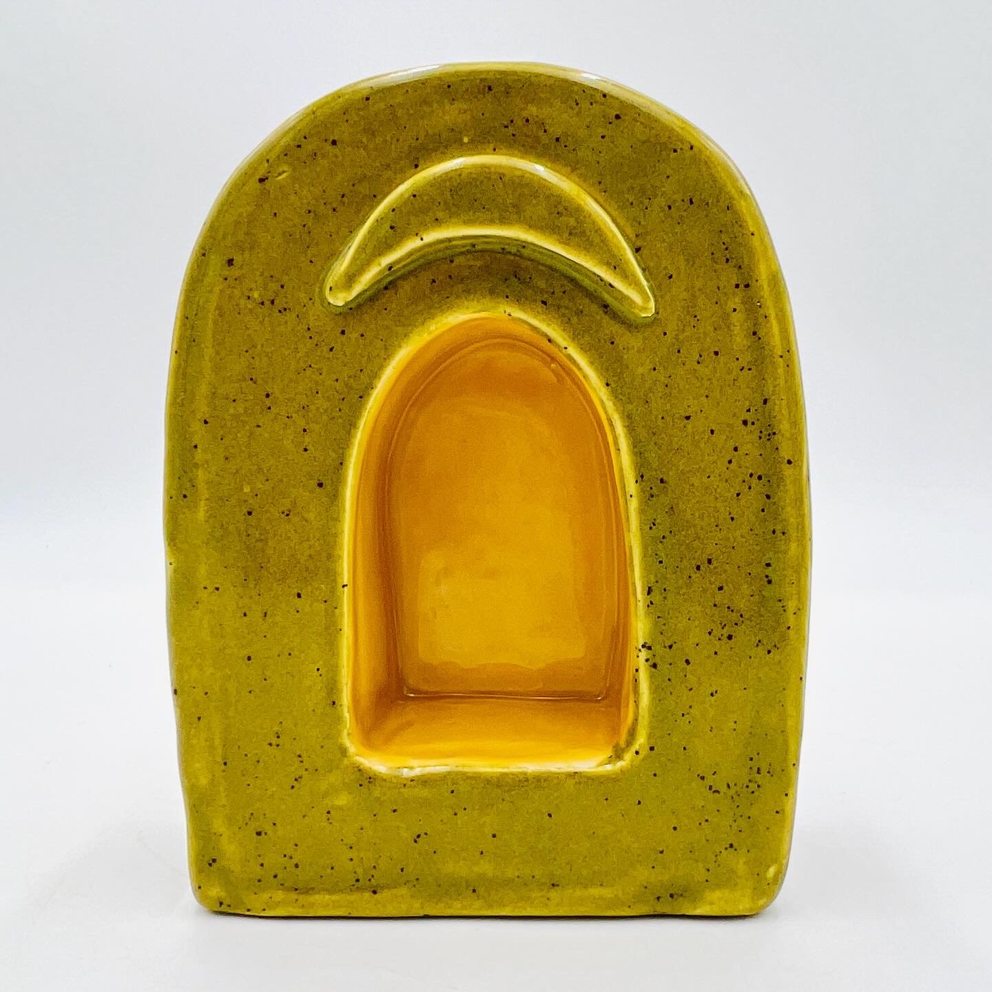  small ceramic alter with green façade and yellow inside