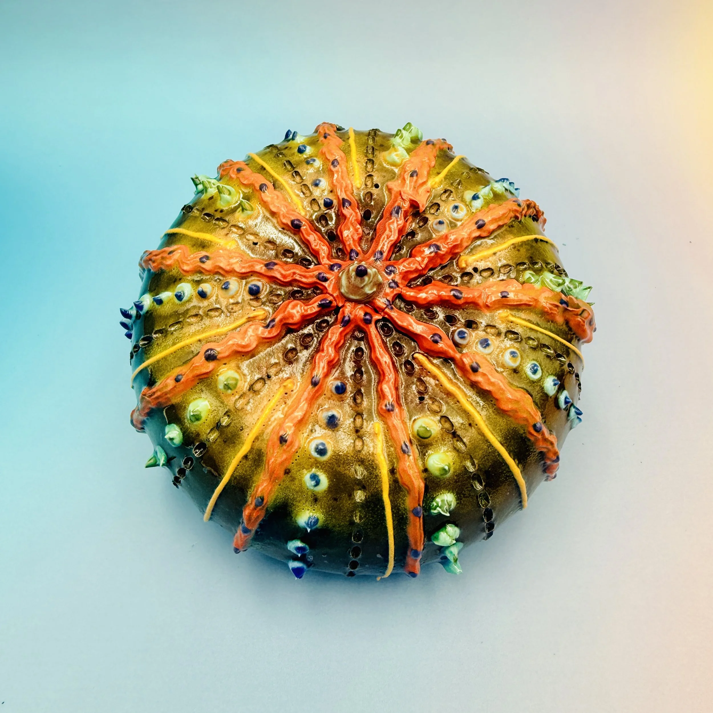 An intricately decorated ceramic sea urchin