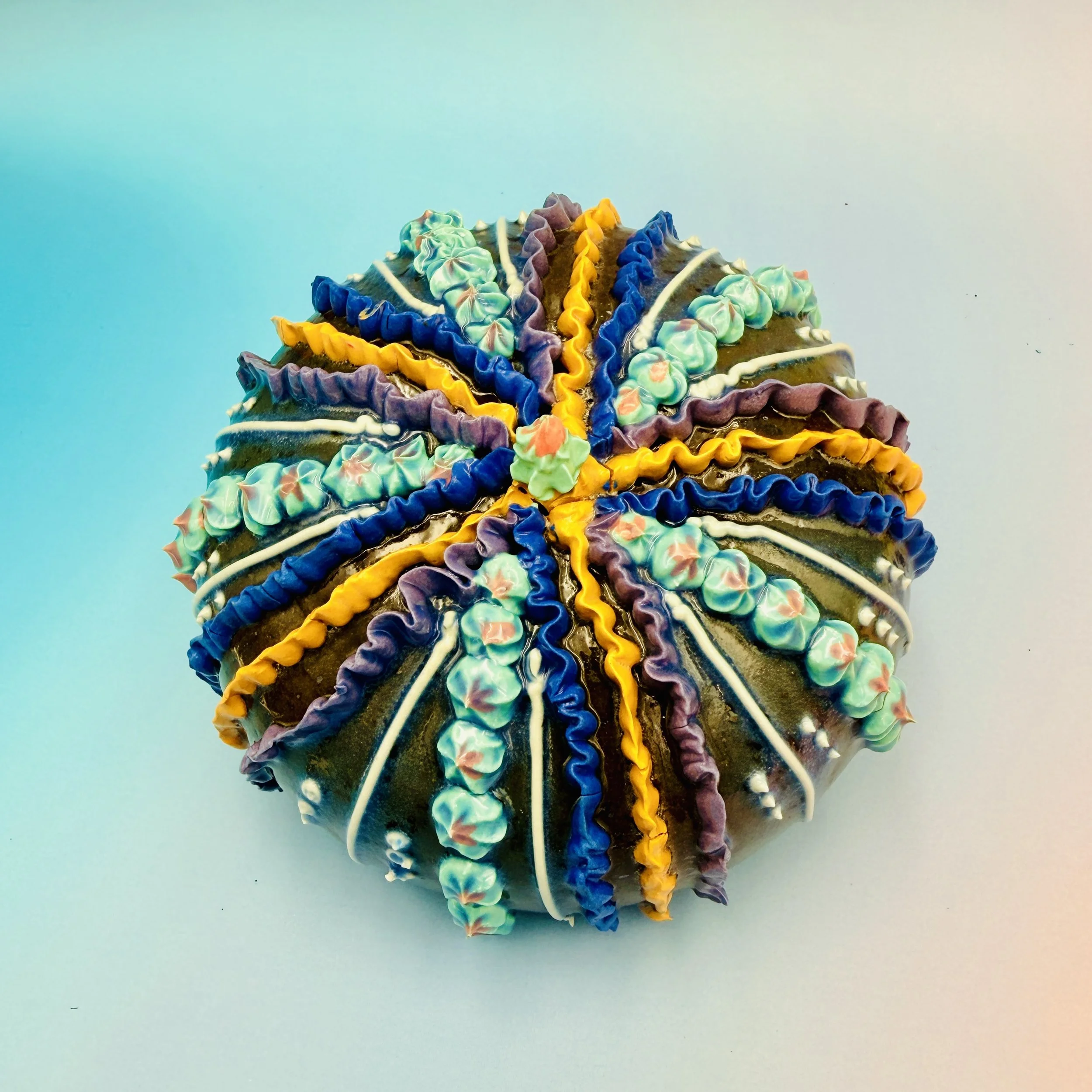 An intricately decorated ceramic sea urchin 