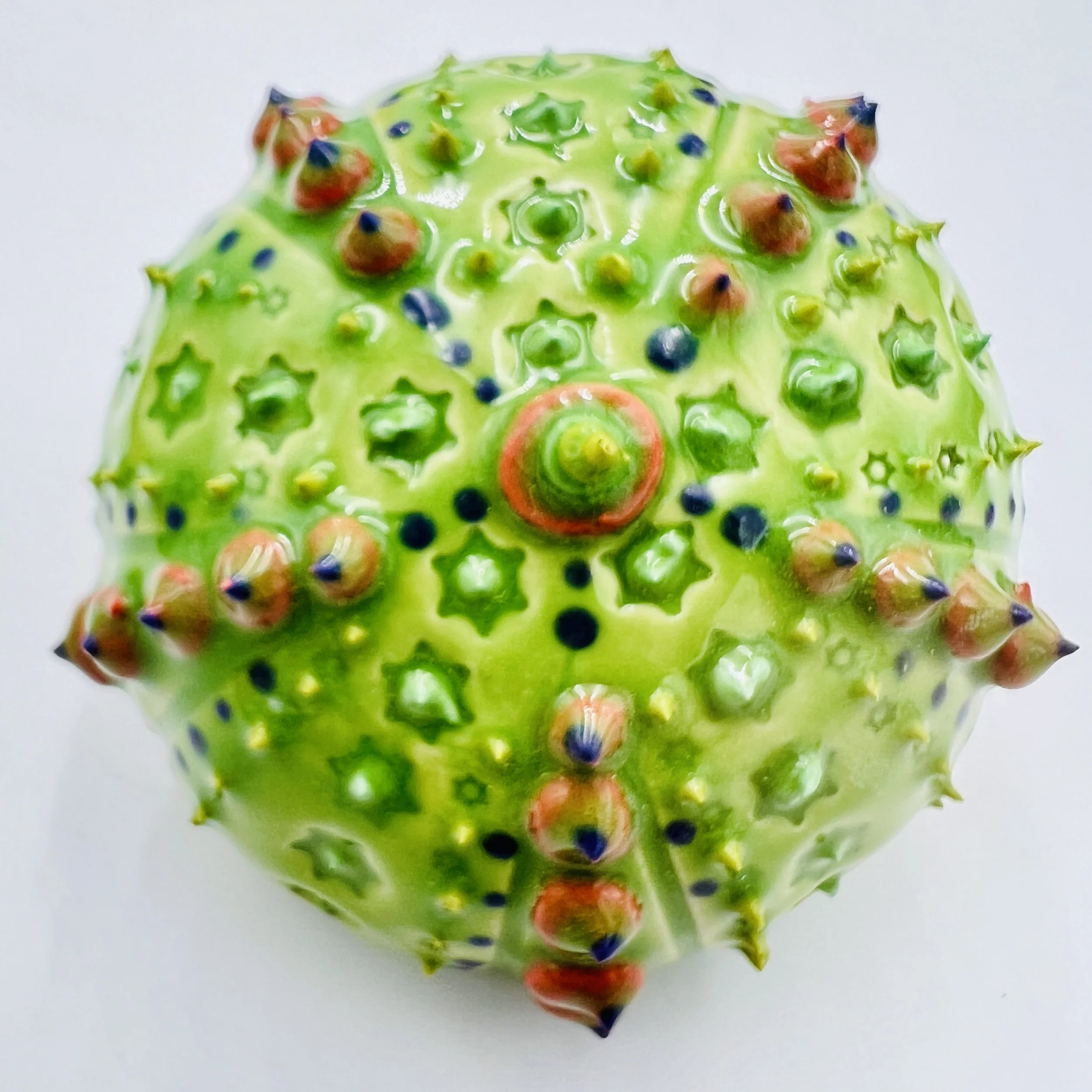 An intricately decorated ceramic sea urchin 