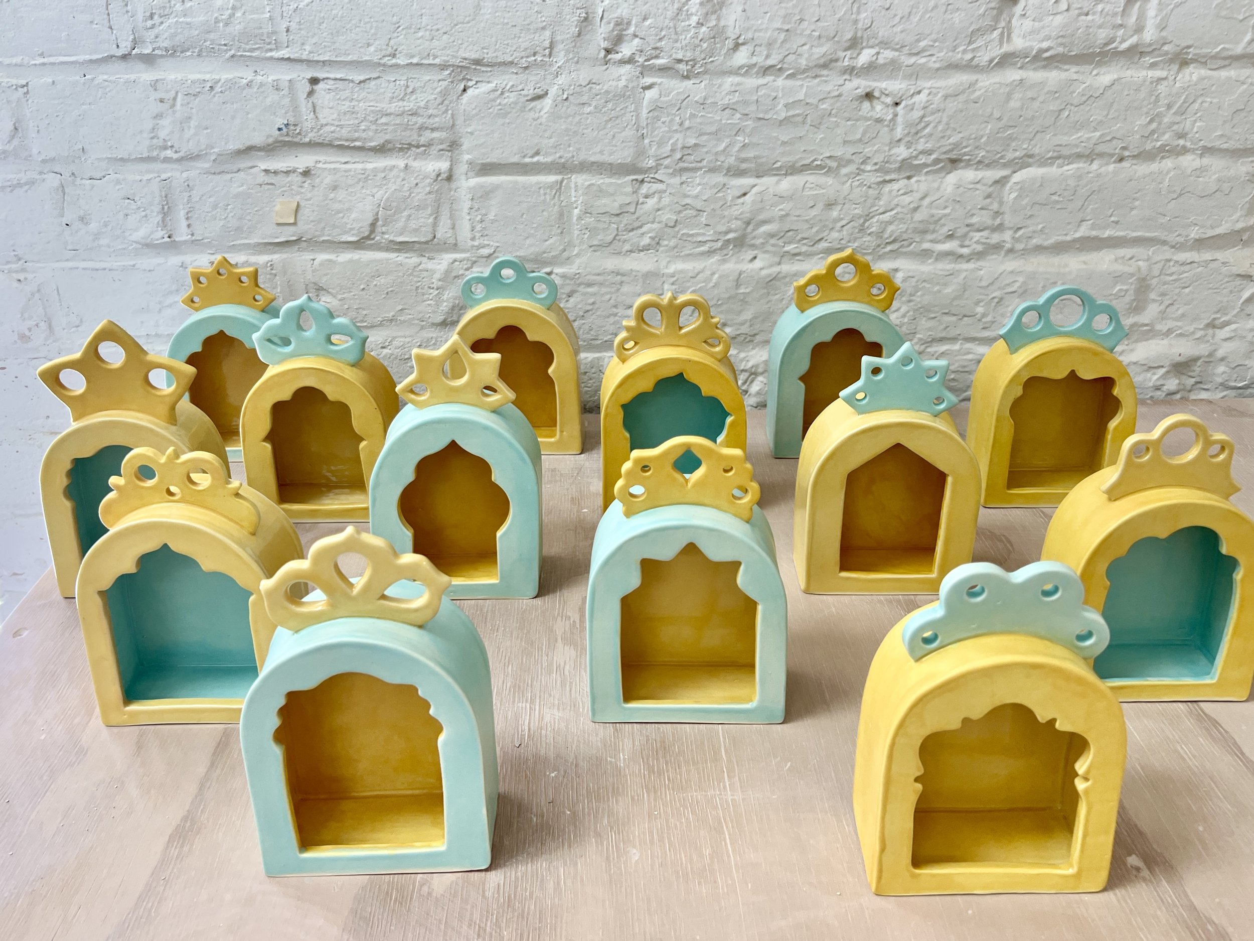  a set of shrines and coordinating colors for the new city arts artist exchange