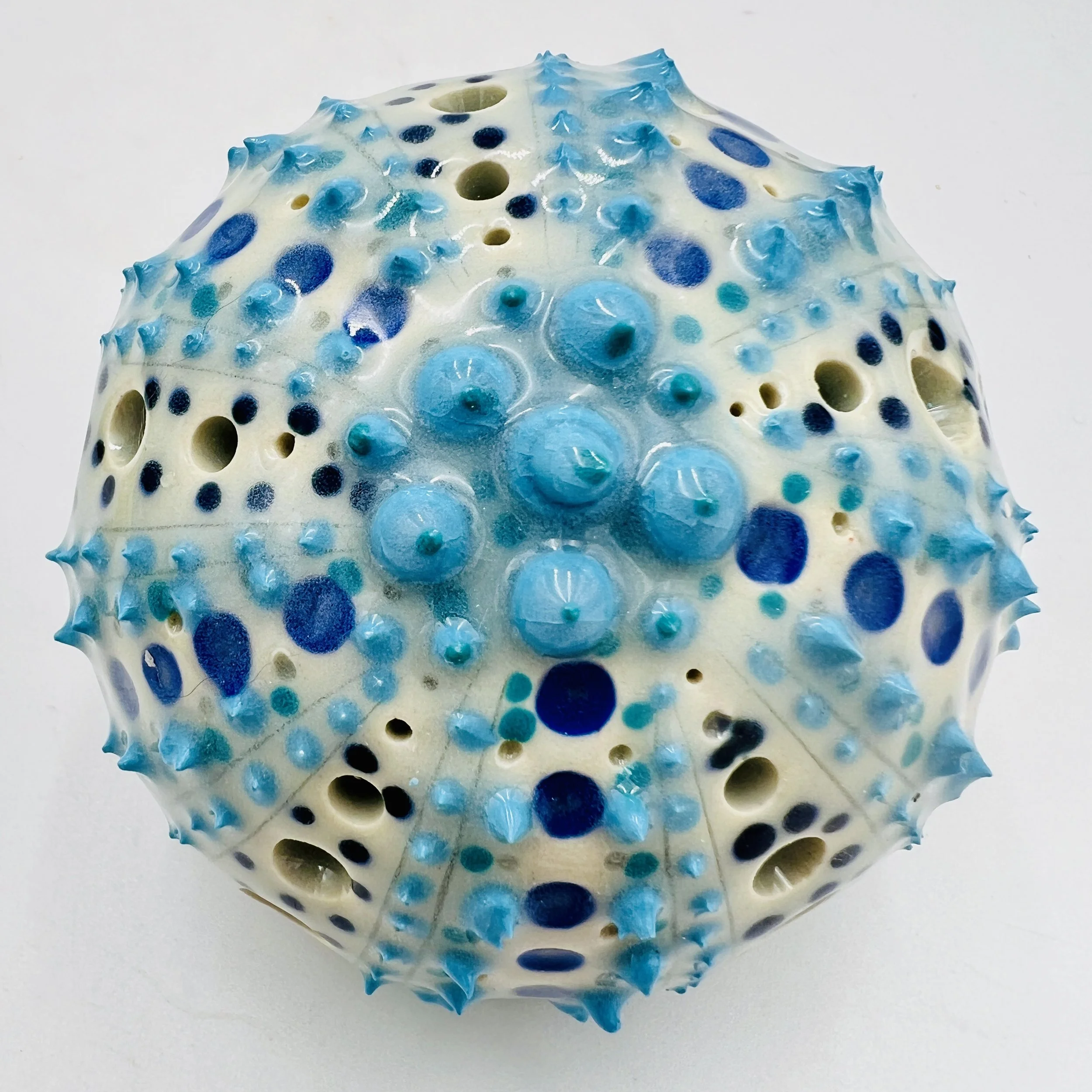 An intricately decorated ceramic sea urchin 