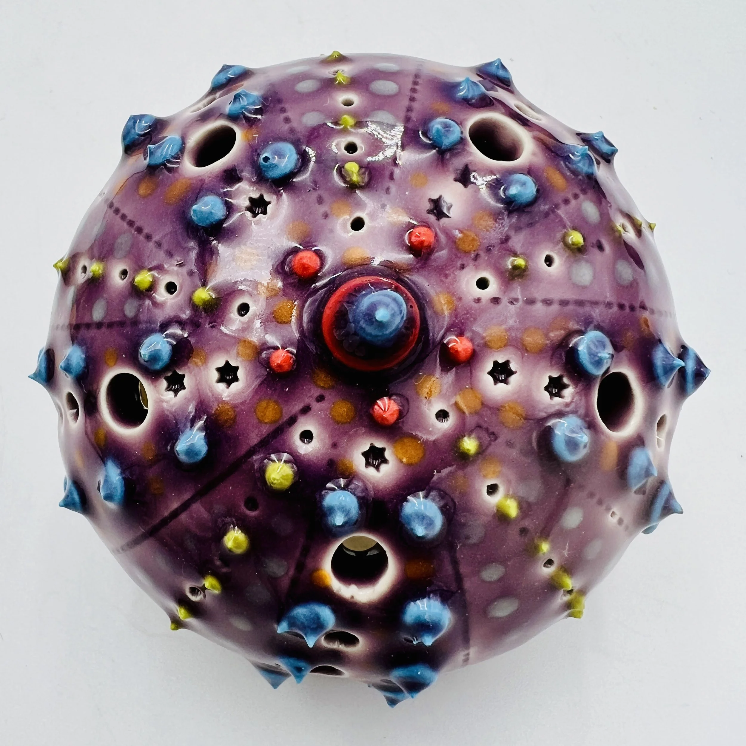 An intricately decorated ceramic sea urchin