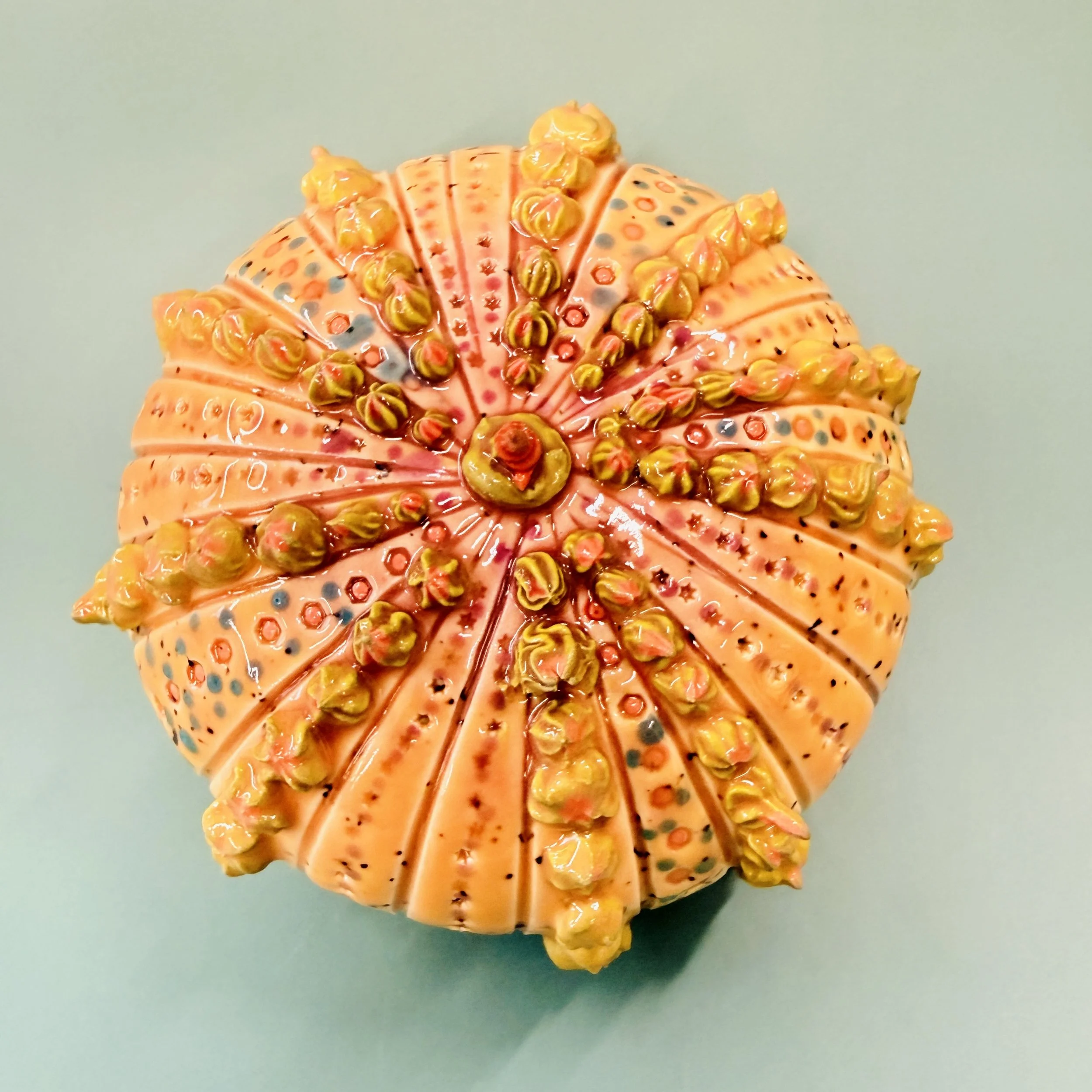 An intricately decorated ceramic sea urchin