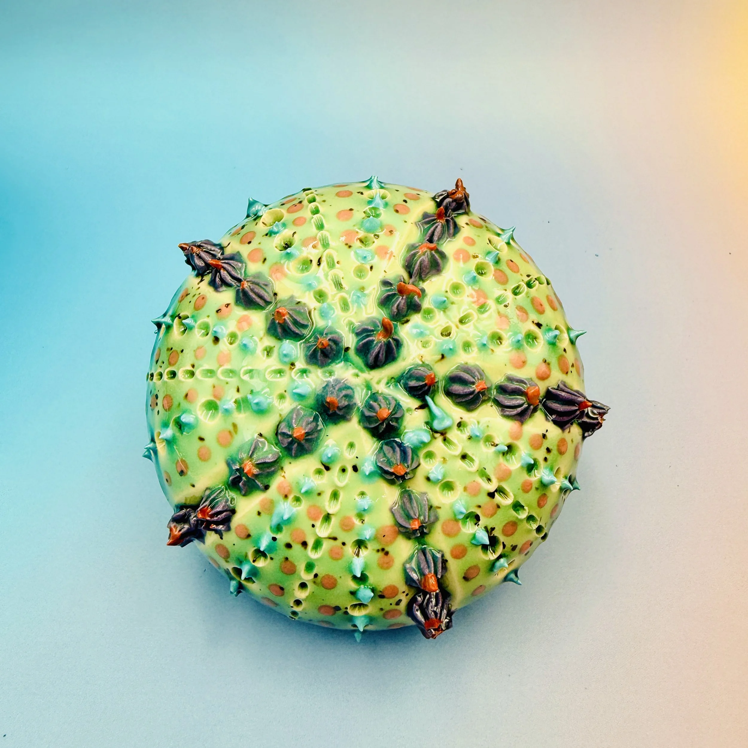 An intricately decorated ceramic sea urchin