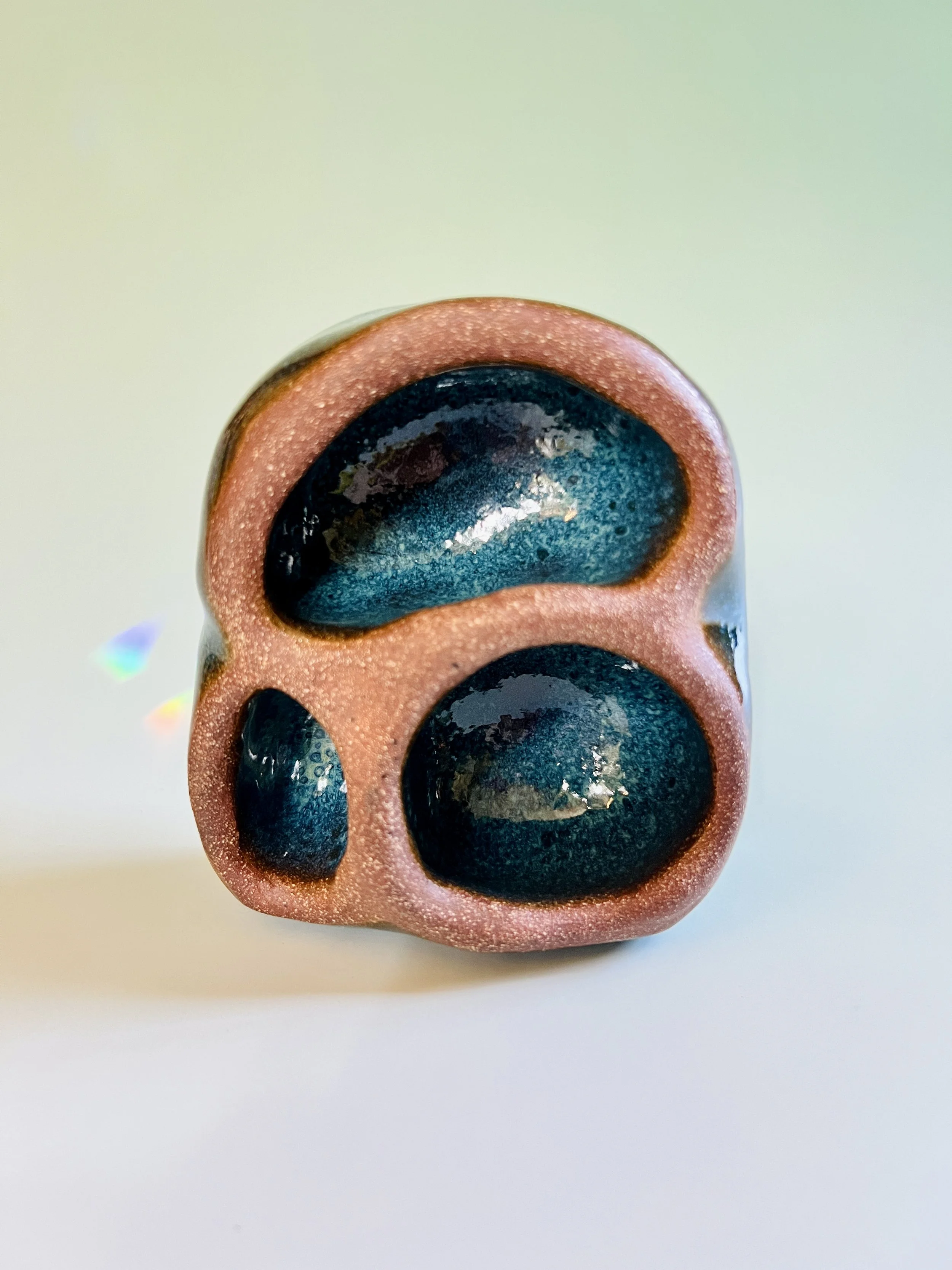 Small organic shrine with dark clay with deep blue glaze