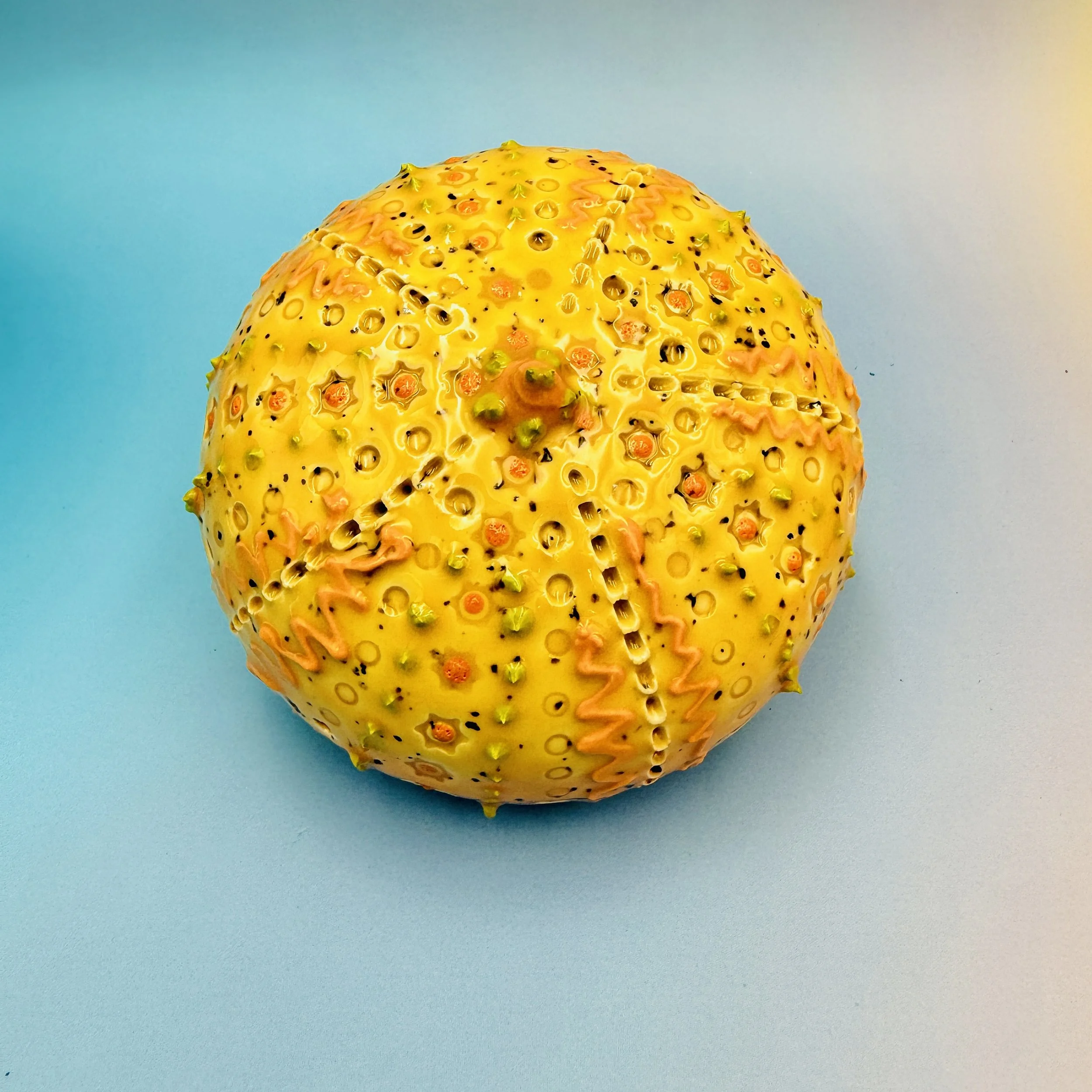 An intricately decorated ceramic sea urchin