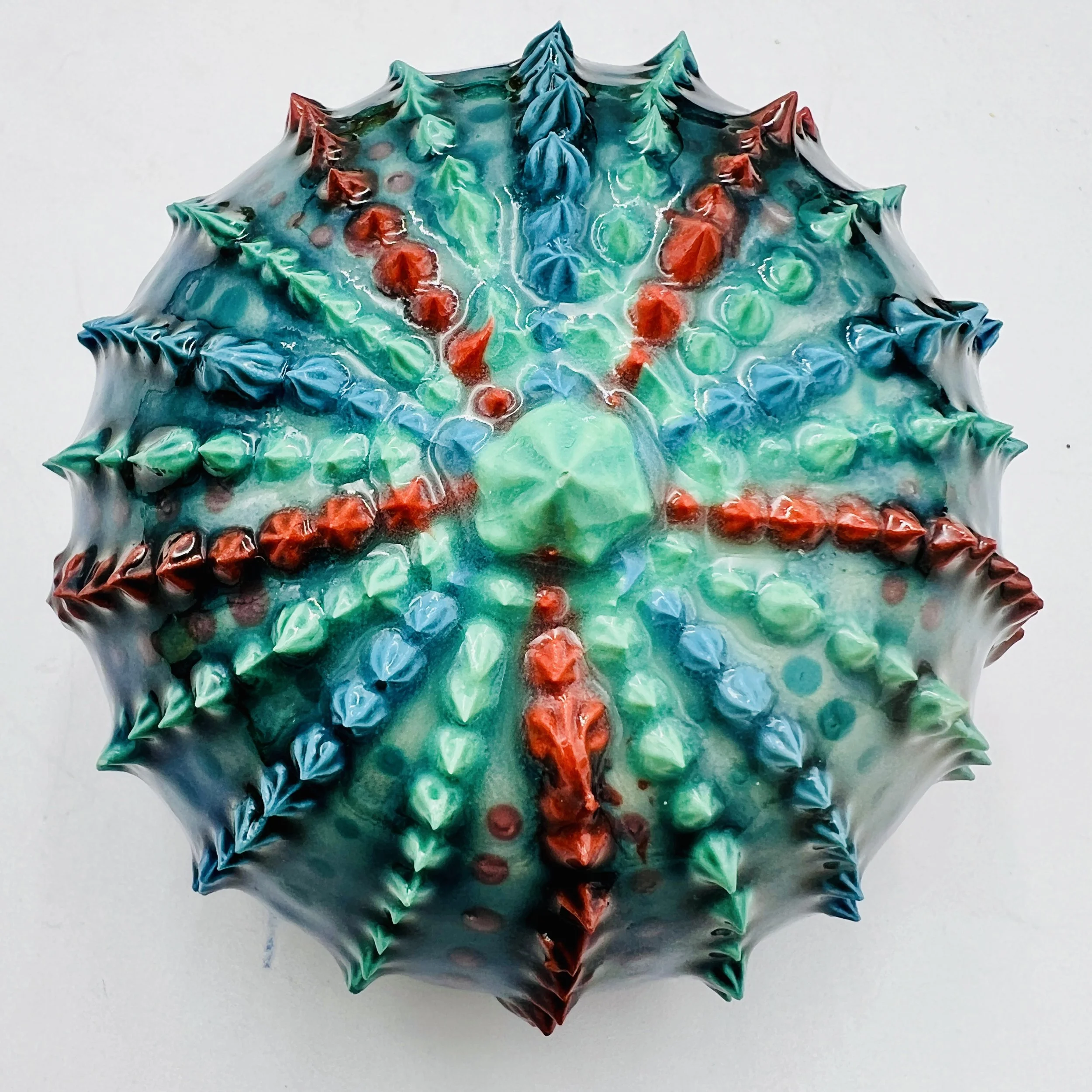 An intricately decorated ceramic sea urchin 