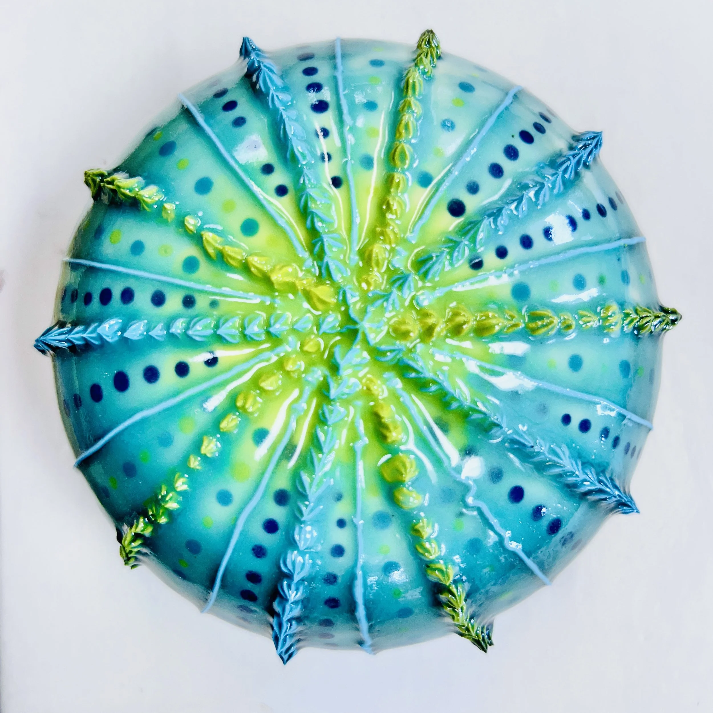 An intricately decorated ceramic sea urchin