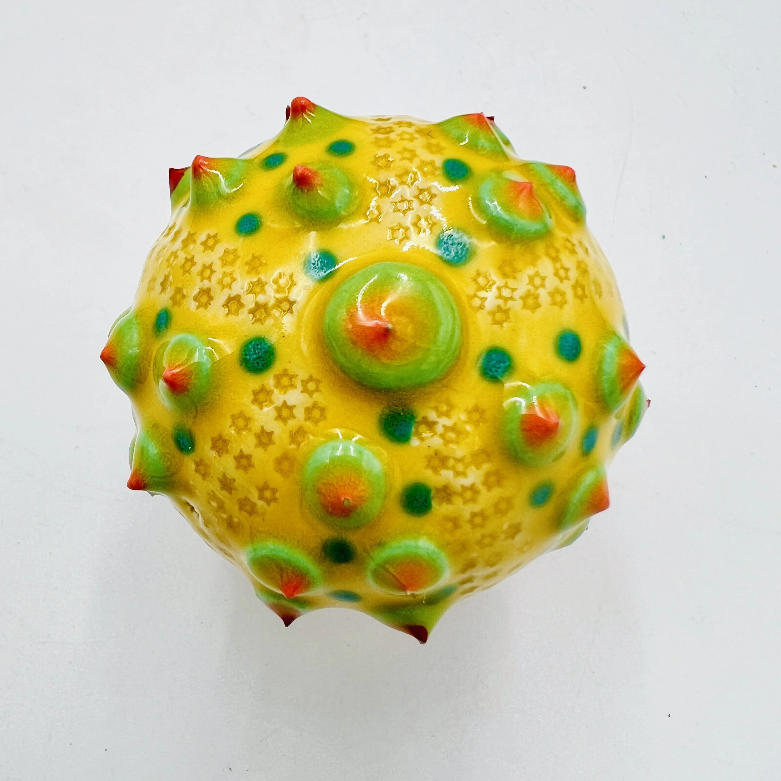 An intricately decorated ceramic sea urchin