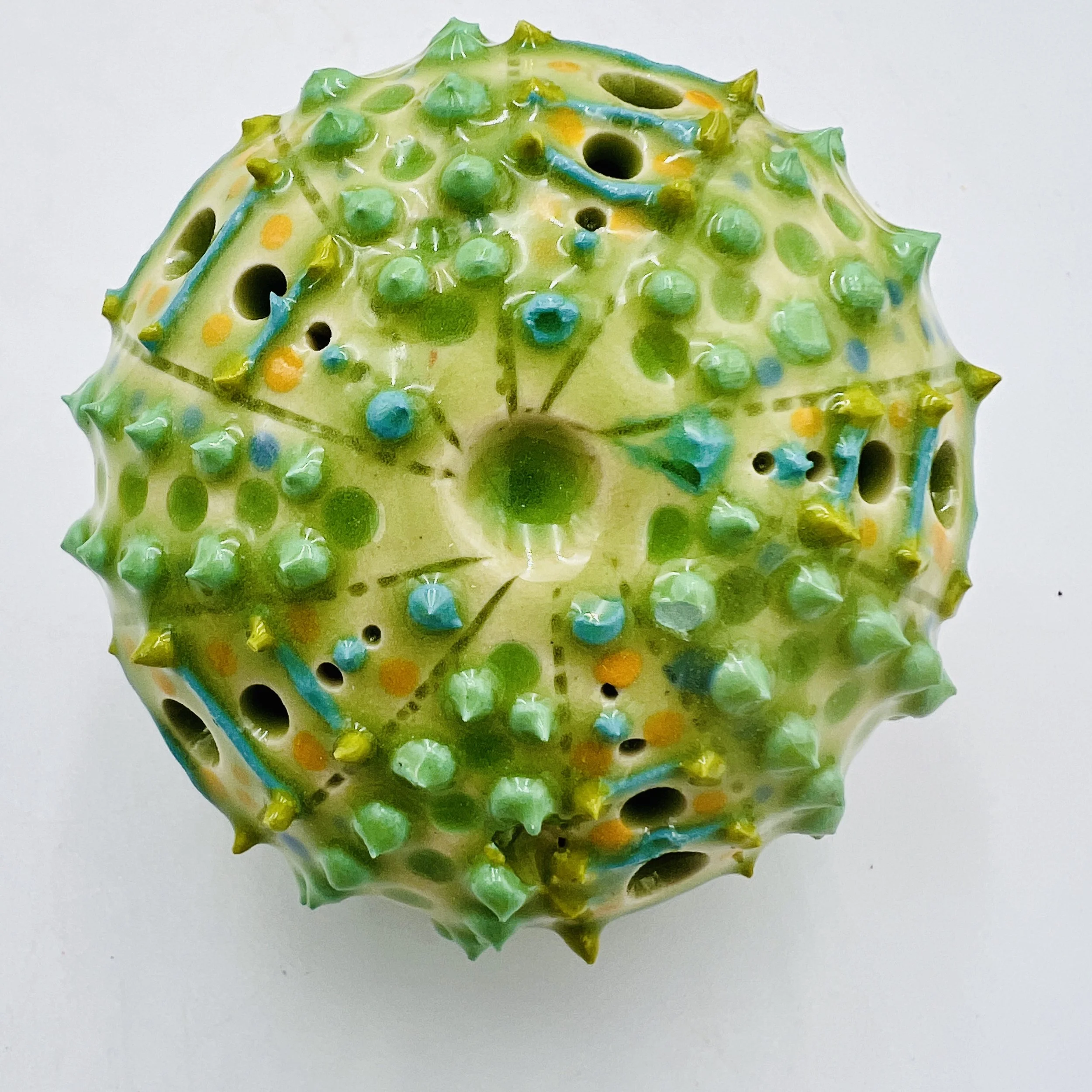 An intricately decorated ceramic sea urchin