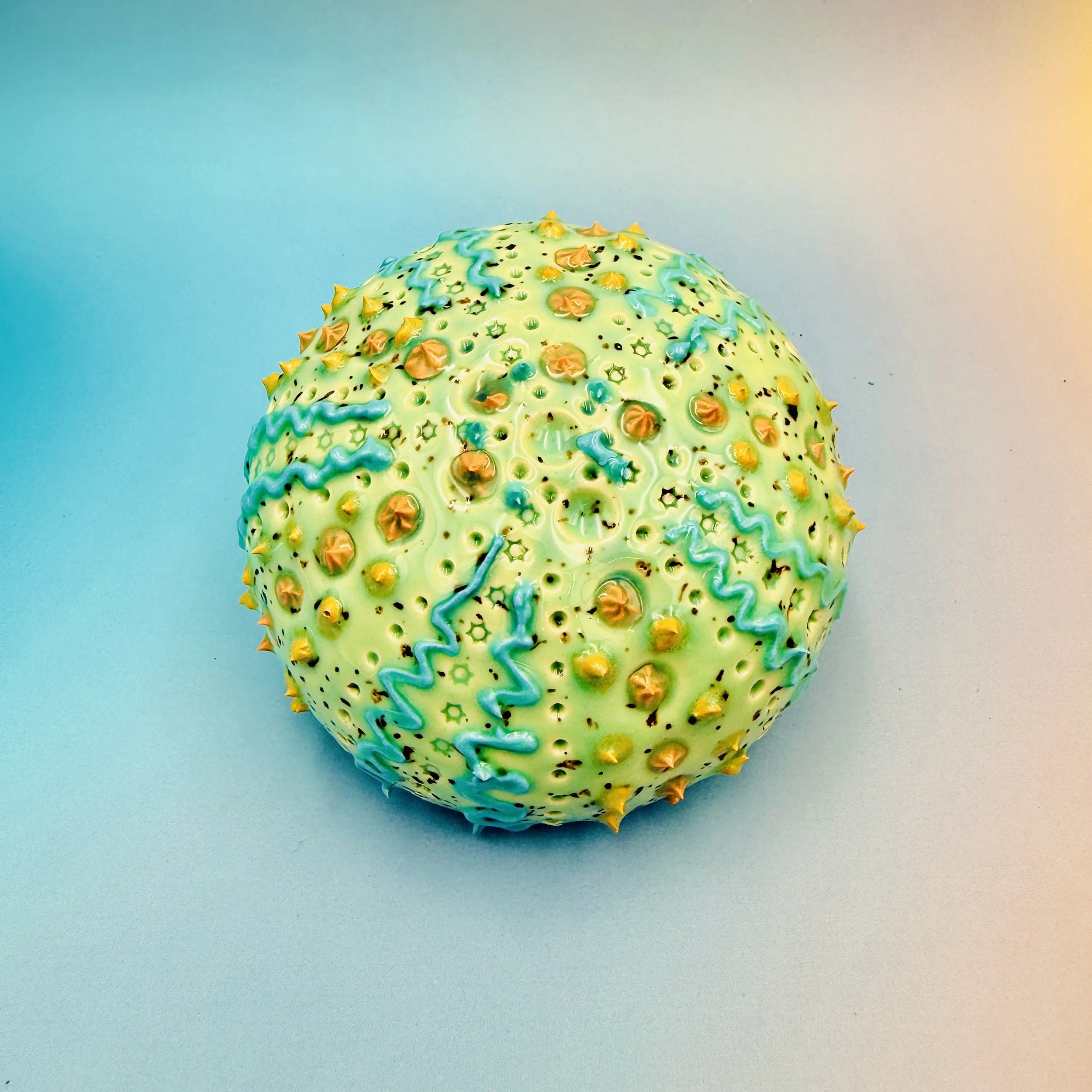 An intricately decorated ceramic sea urchin