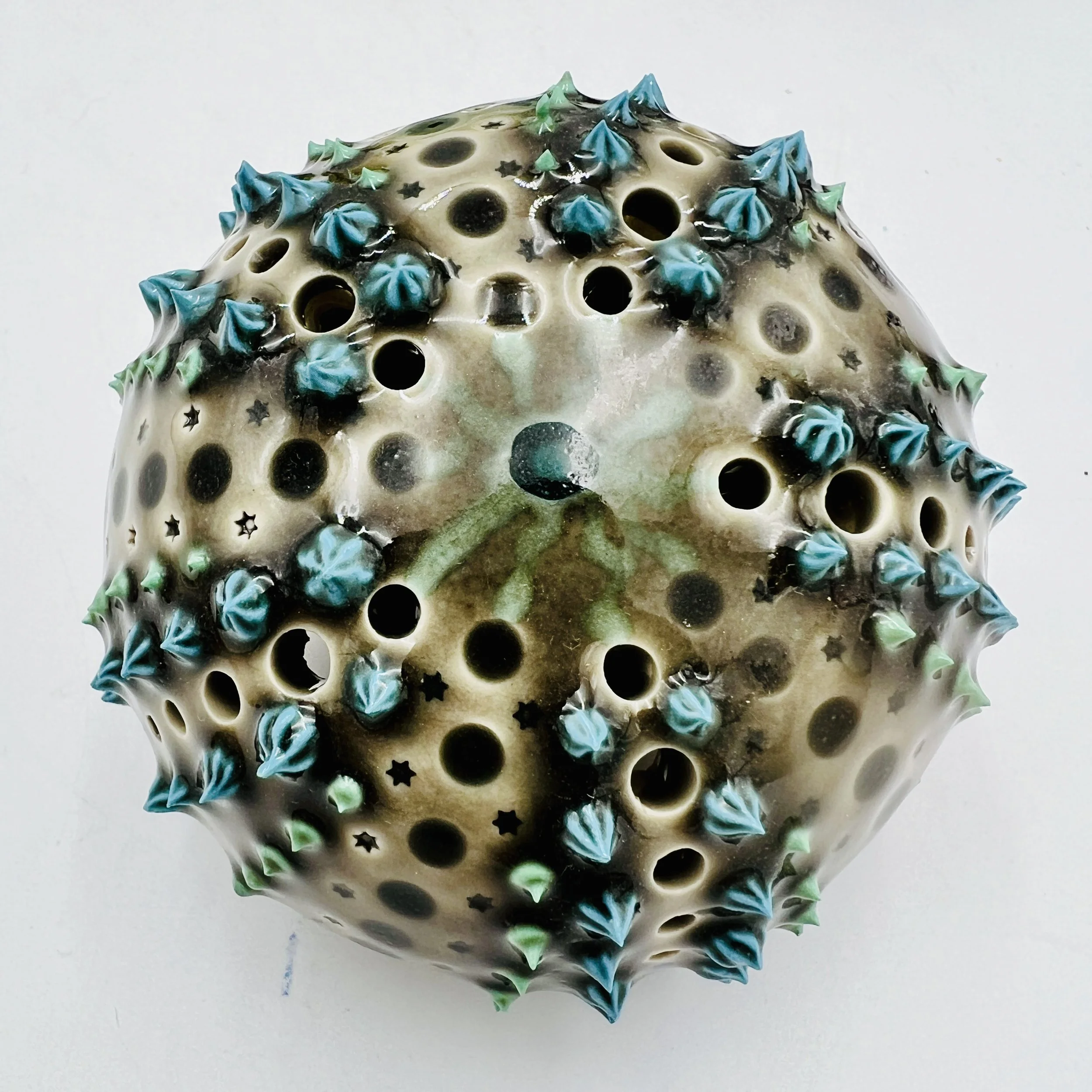 An intricately decorated ceramic sea urchin