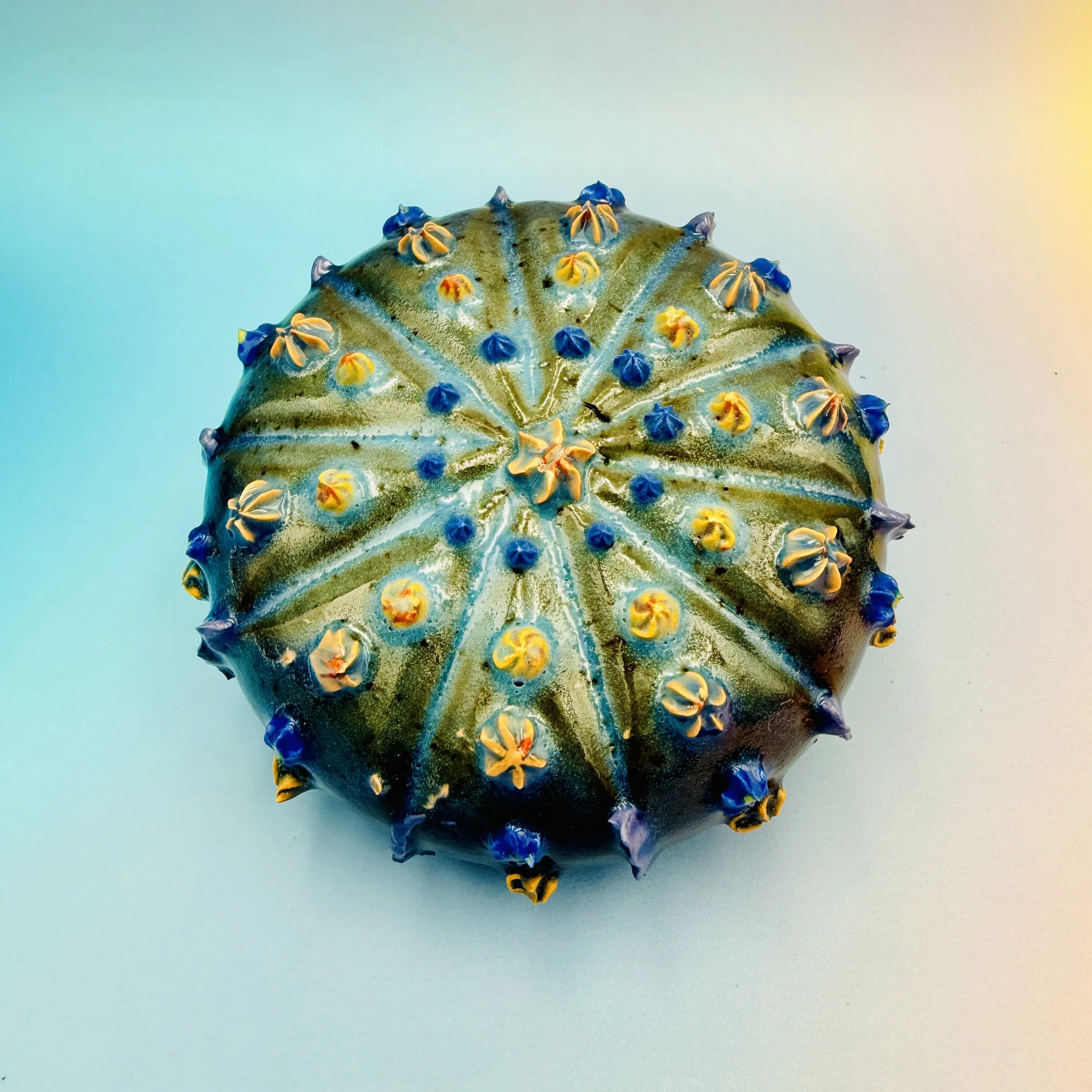 An intricately decorated ceramic sea urchin