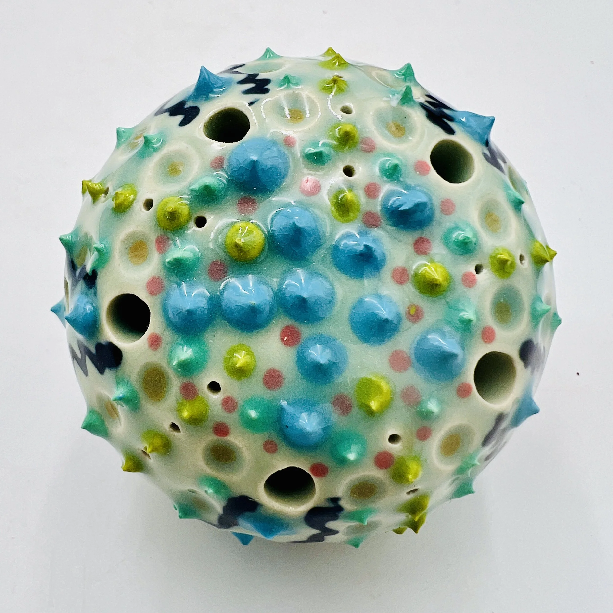 An intricately decorated ceramic sea urchin