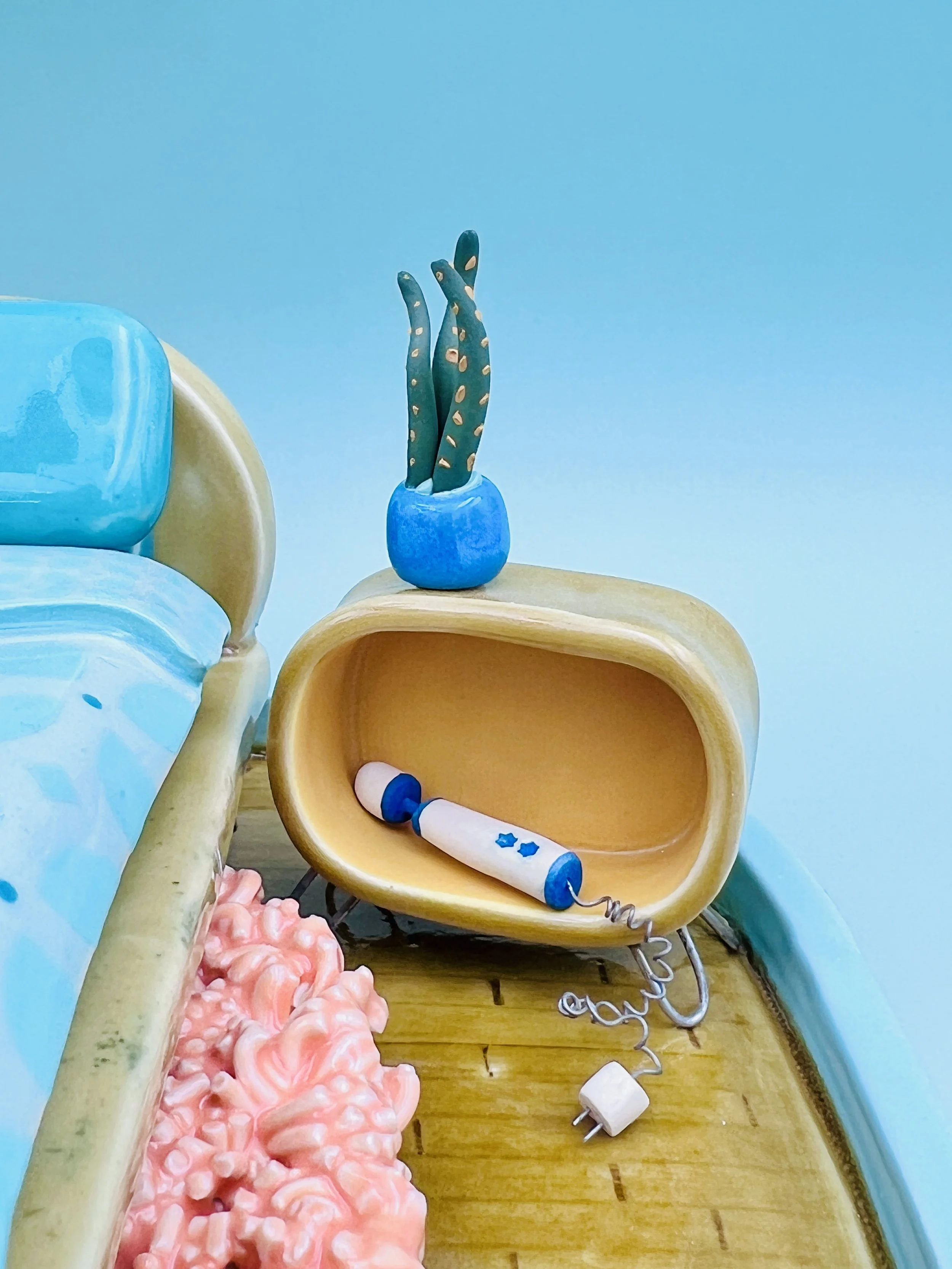  ceramic miniature, mid-century, modern inspired bedroom with bed, globe, lamps, shag, rug, potted plants, lava lamp, two kitties curled up under the bed
