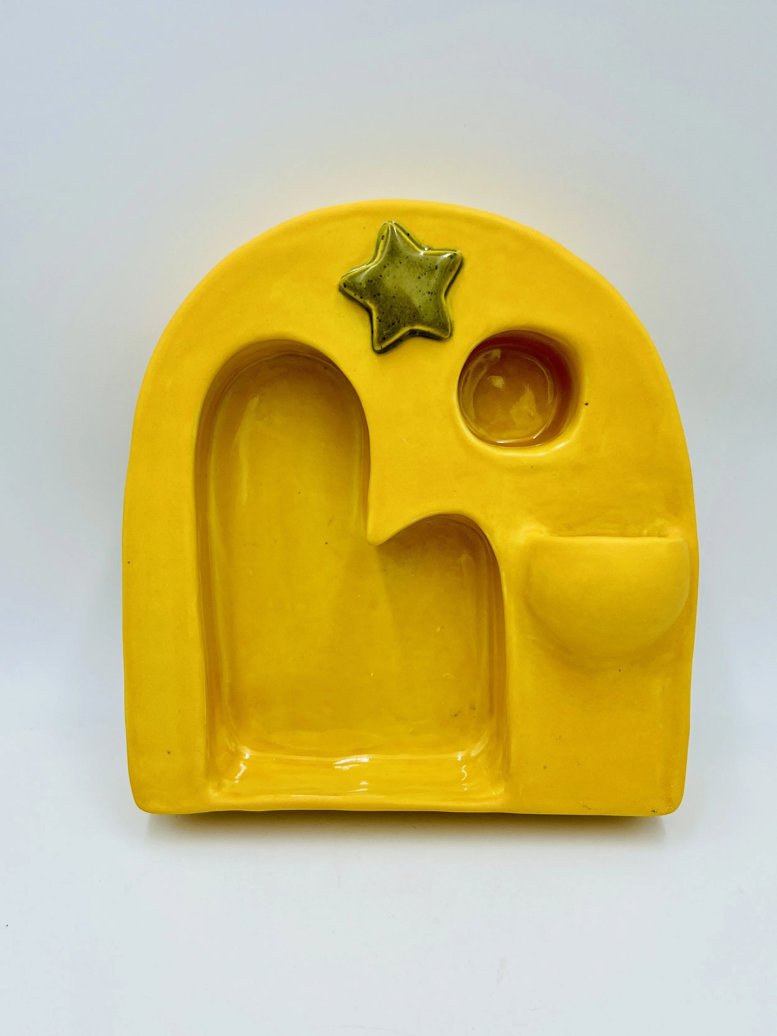  yellow shrine with gold star with rounded shelf round shelf in a little bowl