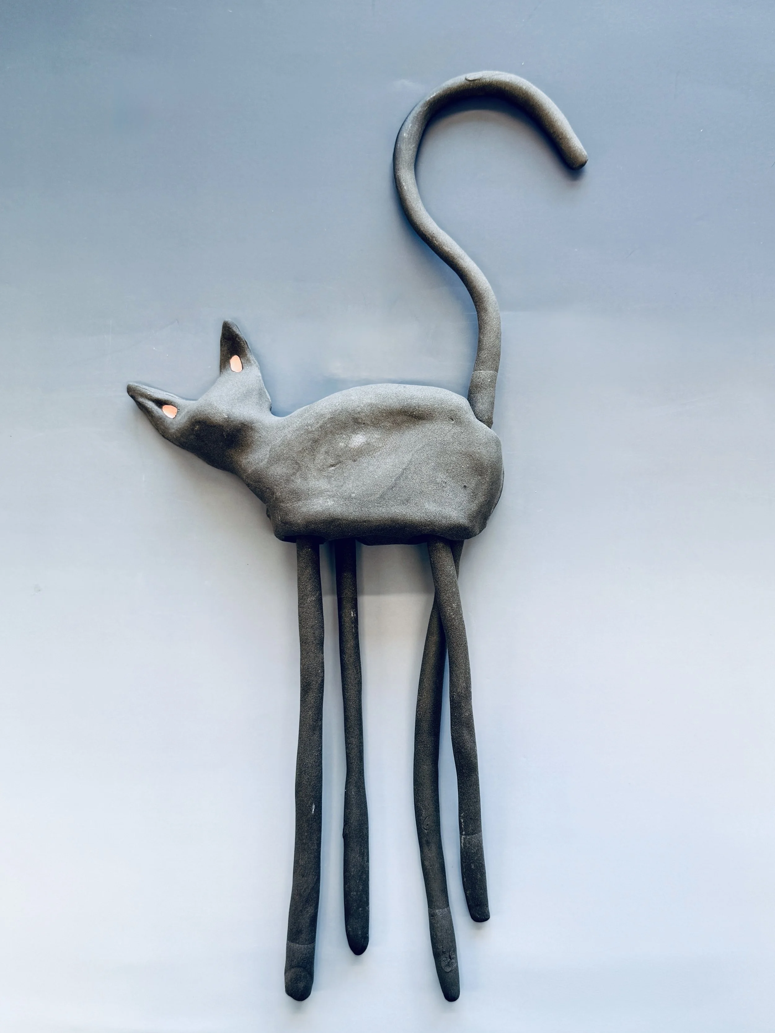  ceramic black cat with surreal, long legs and tail