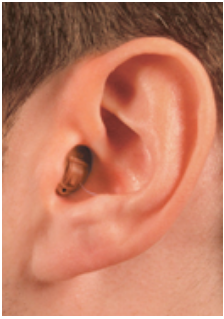 Close-up of a person's ear with a black in-ear earbud.