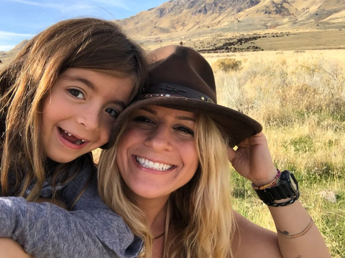 Women's empowerment expert Dr. Alice Atalanta with her daughter on an adventure in Utah, feeling empowered, inspired, joyful, and free.