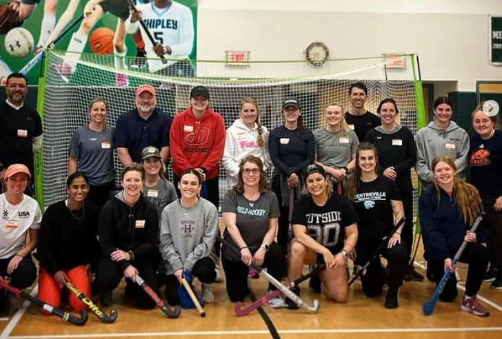 Women's empowerment expert Dr. Alice Atalanta pictured with a group of female coaches training with USA Field Hockey coaches certification team, including Olympians and collgiate athletes and coaches.