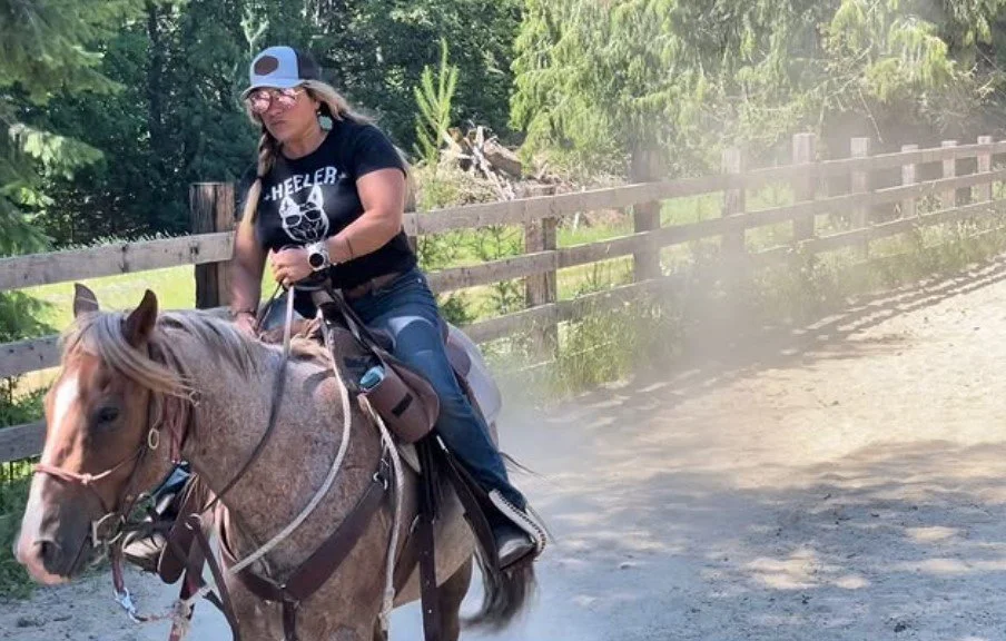 Women's empowerment expert and rescuer of a strawberry roan mustang Dr. Alice Atalanta cantering on a strawberry roan mustang out west feeling strong and empowered and joyful and fulfilled.