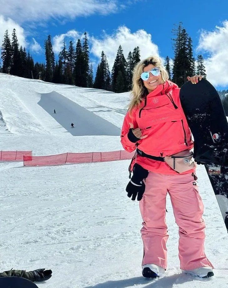 Women's empowerment expert and collegiate all american snowboarder for the university of virginia uva Dr. alice atalanta ph.D. after snowboarding through the halfpipe at Northstar at Tahoe