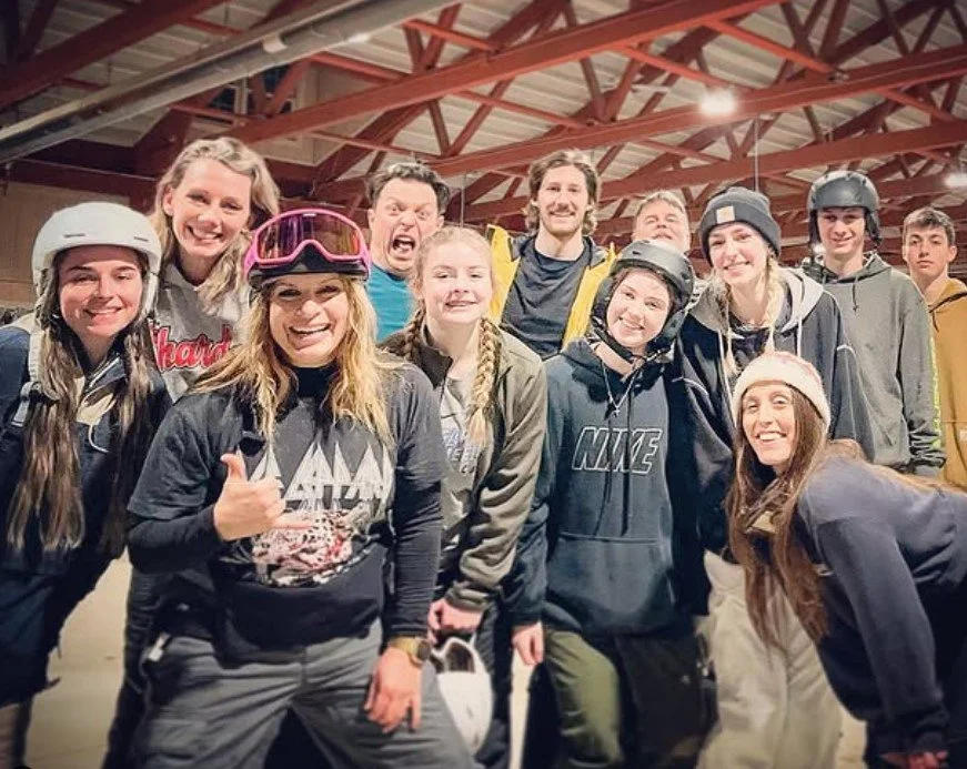 Women's empowerment expert and collegiate all american snowboarder for the university of virginia uva Dr. Alice Atalanta pictured with fellow snowboard instructors at vail resorts alpine valley