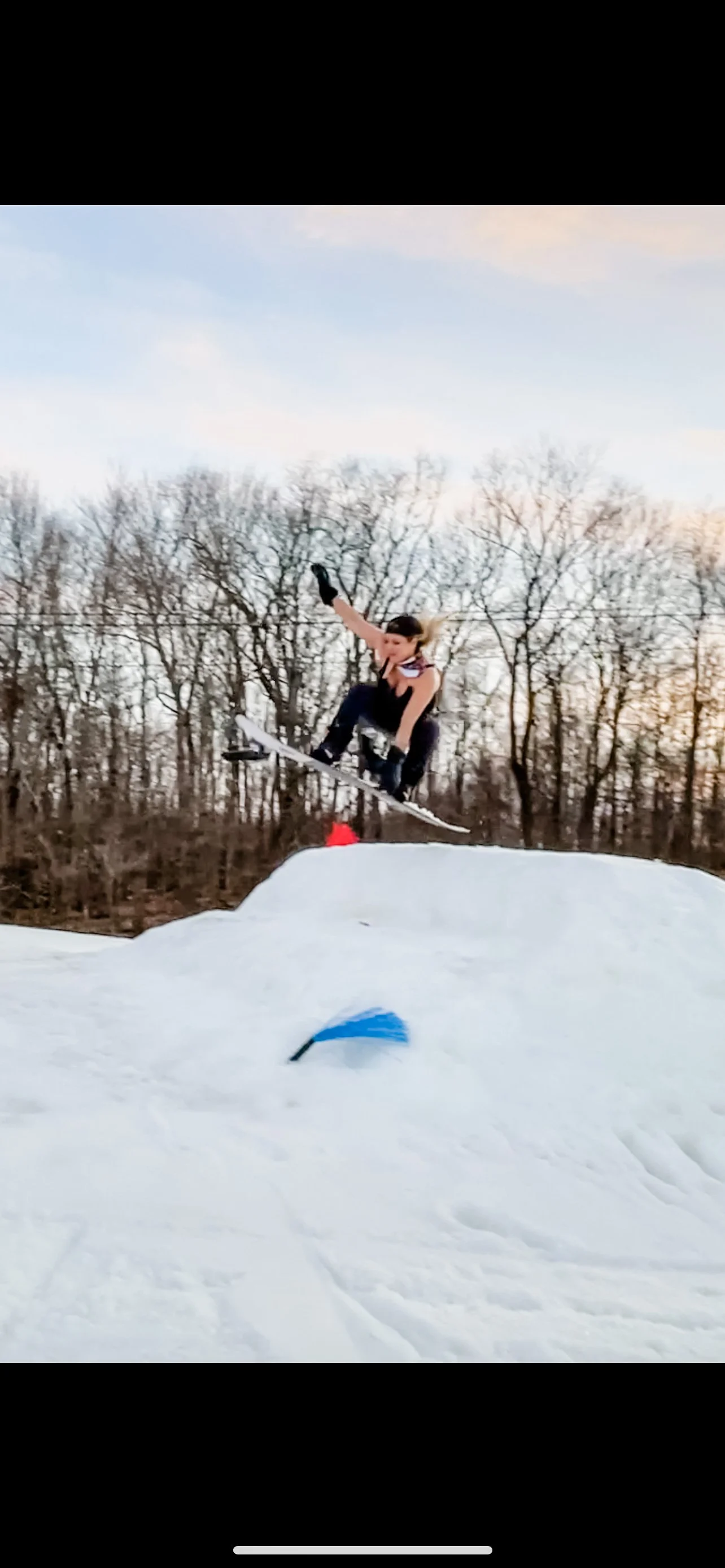 	
women's empowerment expert and Collegiate All-American Snowboarder for the University of Virginia (UVA) Dr. Alice Atalanta going off a snowboard jump feeling confident, strong, and brave.