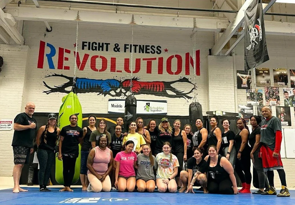	
Women's empowerment expert Dr. Alice Atalanta pictured at Revolution Fight & Fitness in Euclid Ohio after a women's empowerment boxing and self-defense seminar with a group of women feeling strong and empowered