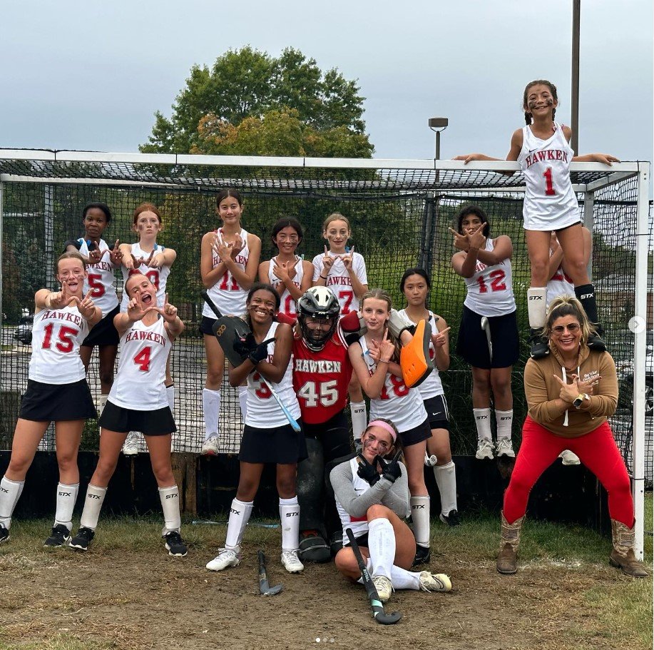 	
Women's empowerment expert dr. alice atalanta pictured with the field hockey team she coaches as they celebrate a win feeling empowered, joyful, confident, powerful, and athletic.