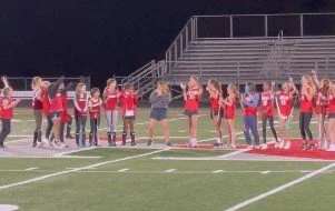 women's empowerment expert dr. Alice atalanta pictured with her field hockey team in a moment of sisterhood