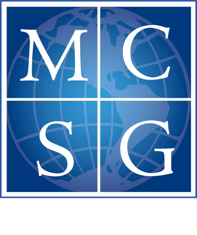 Blue and white logo with the letters M, C, S, and G arranged in quadrants over a globe background.