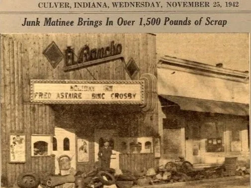 A vintage black-and-white photo of a theater marquee and entrance, with a headline about junk being brought in as scrap, dated November 25, 1942, in Culver, Indiana.