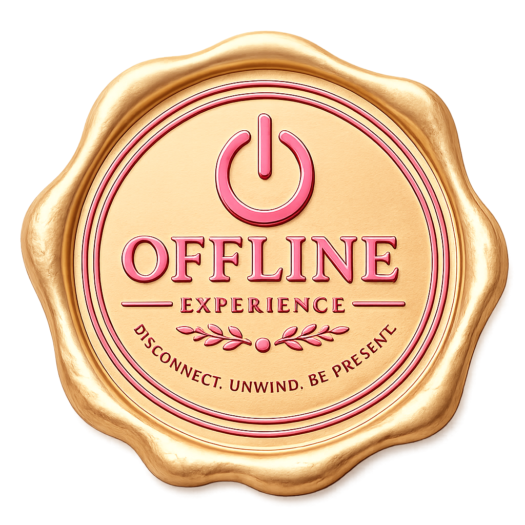 A badge with a gold border and a pink power button symbol at the top, with the words 'Offline Experience' in pink, and the phrase 'Disconnect. Unwind. Be Present' at the bottom.