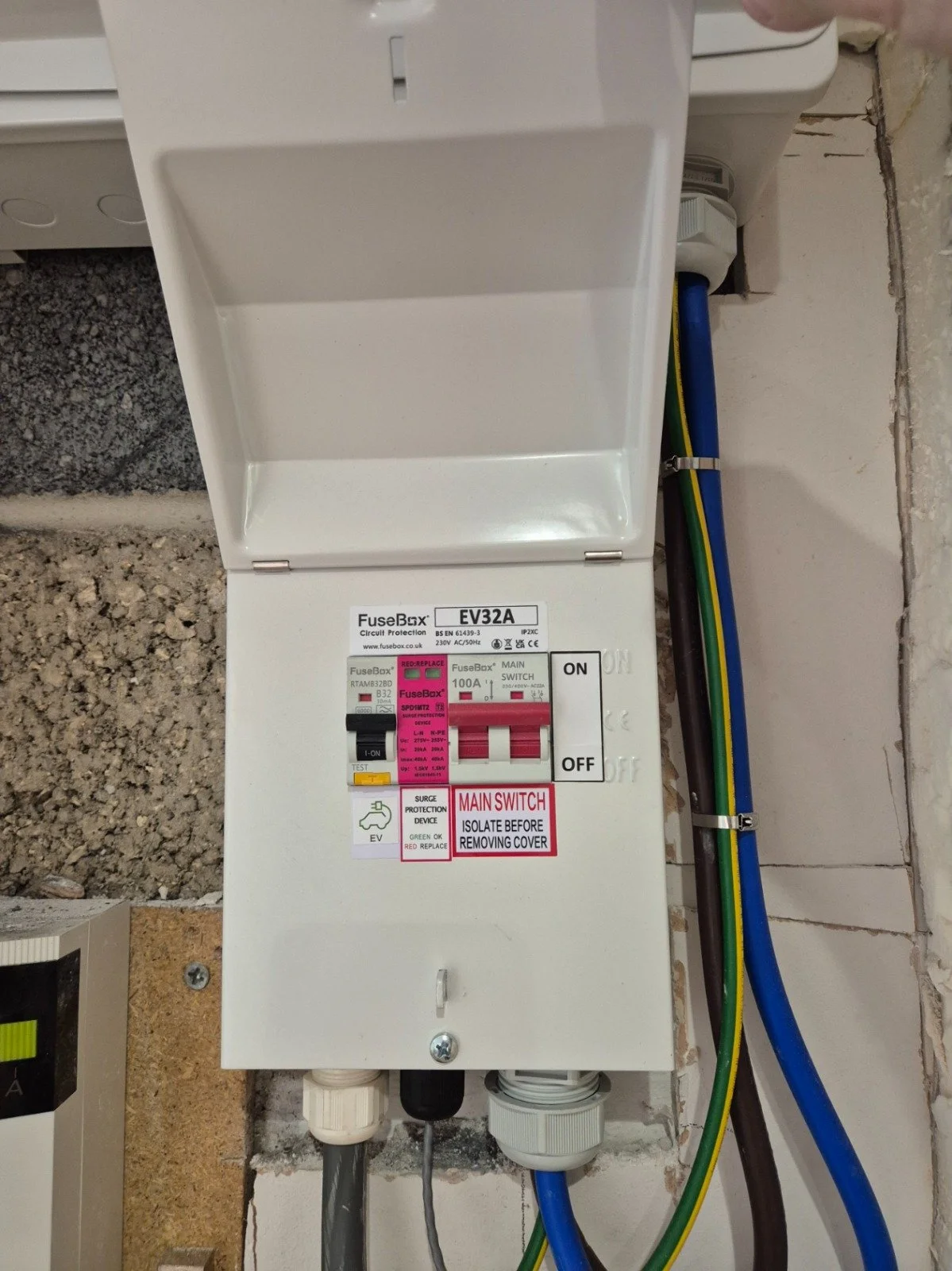 Electrical consumer unit and wiring with various colored wires connected to it.
