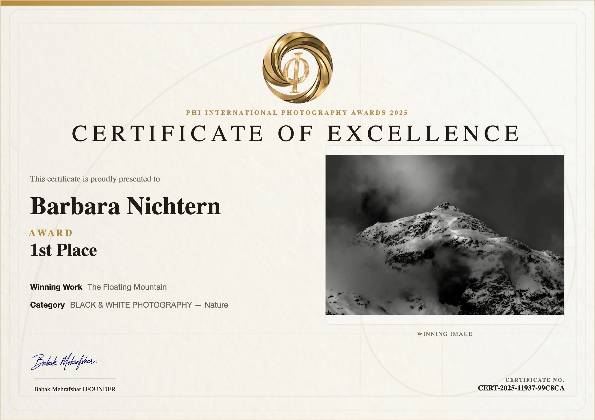 A certificate of excellence awarded at the Phi International Photography Awards 2025 for a black and white nature photograph of a snow-covered mountain. The certificate includes a gold and black logo at the top, the recipient's name, Babak Mehrafshar