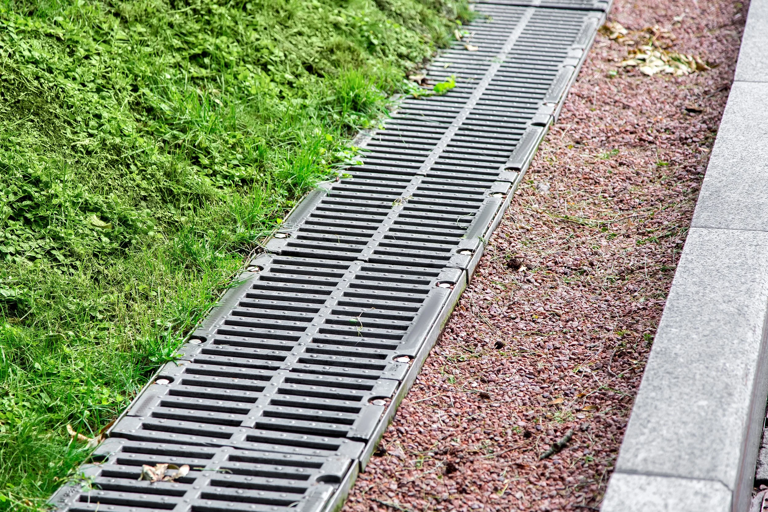 French drains, downspout management, catch basins, channel drains, dry creek beds, swales, and custom drainage systems designed to move water where it belongs.