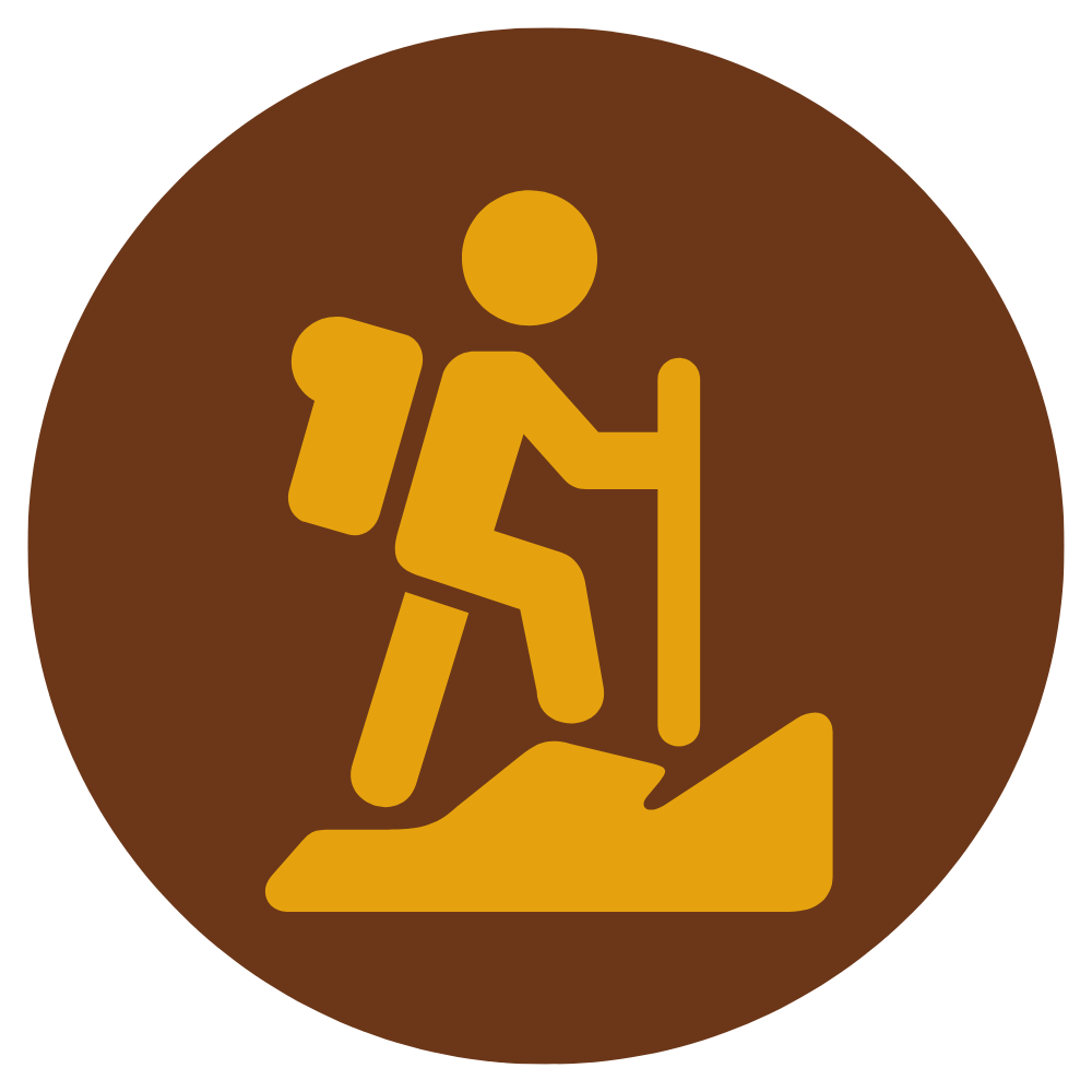 Hiking icon showing a person with a backpack walking on a trail with a hiking stick.