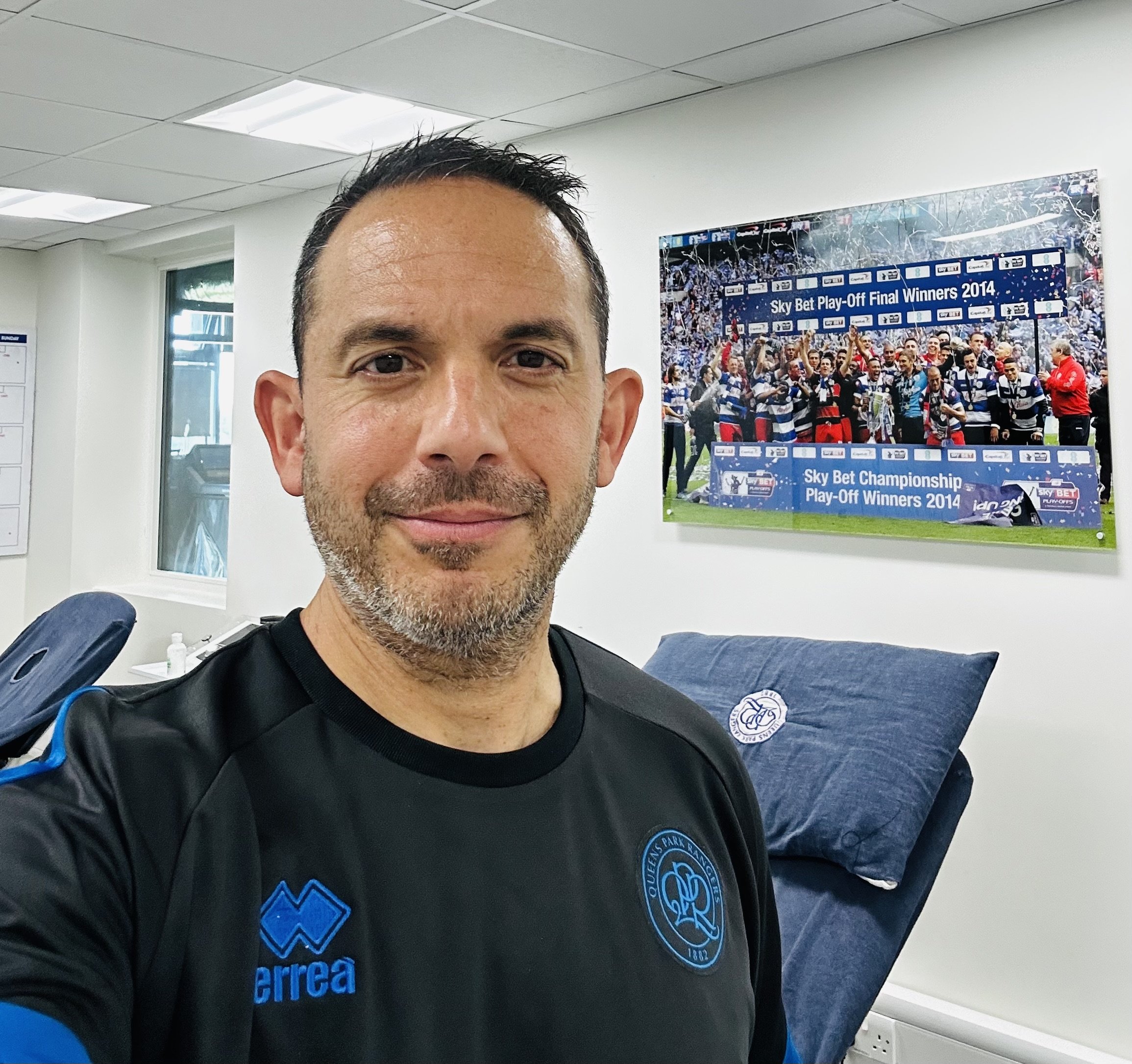 Stel, founder of Kinesis Performance, in a sports treatment room at Queens Park Rangers