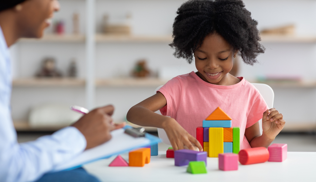 a student or trainee in a clinical setting: ABA student learning to define behaviour precisely — supported by NeuroCore's clinical training program
