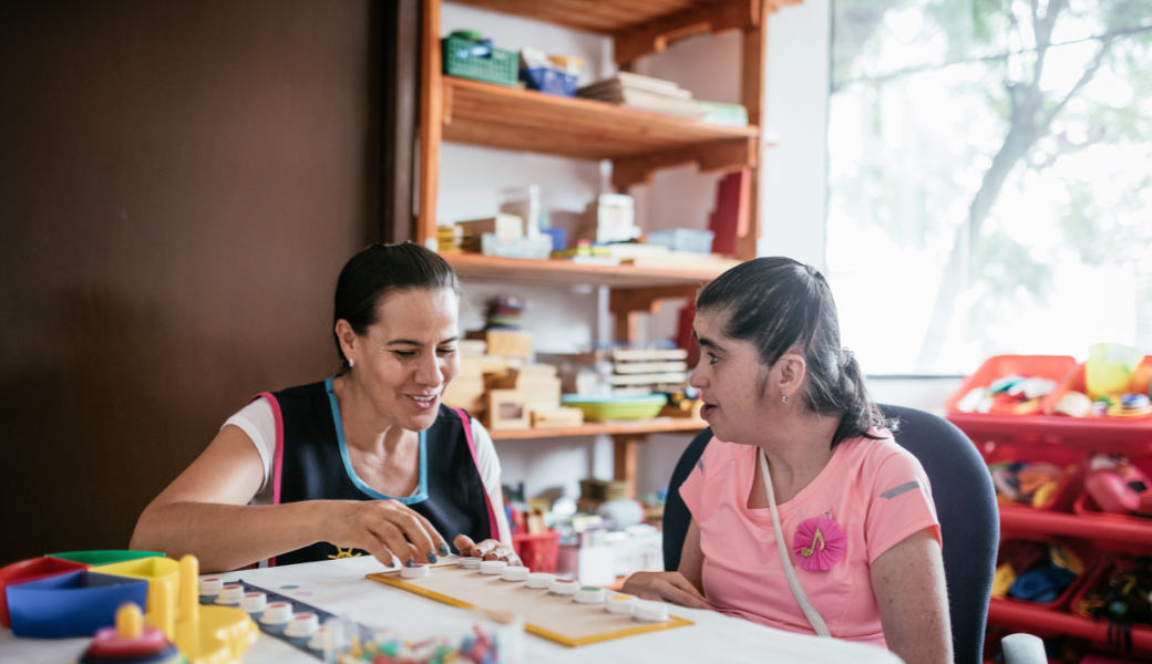 Parent responding to a child's early communication gesture — NeuroCore's communication partnership approach