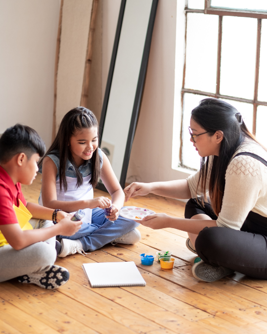 Two children building authentic connection through a shared interest activity — supported by NeuroCore Dubai